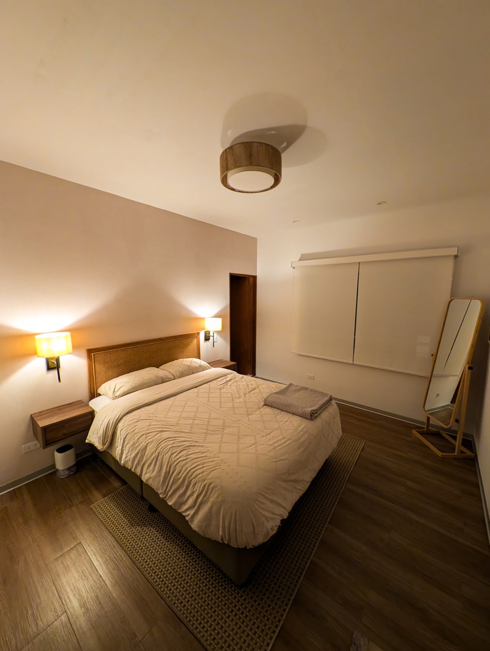 Primary bedroom in warm evening light